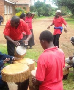 The Trade School students drum, dance and sing to welcome the long-awaited container. It has been released with a tax exemption.